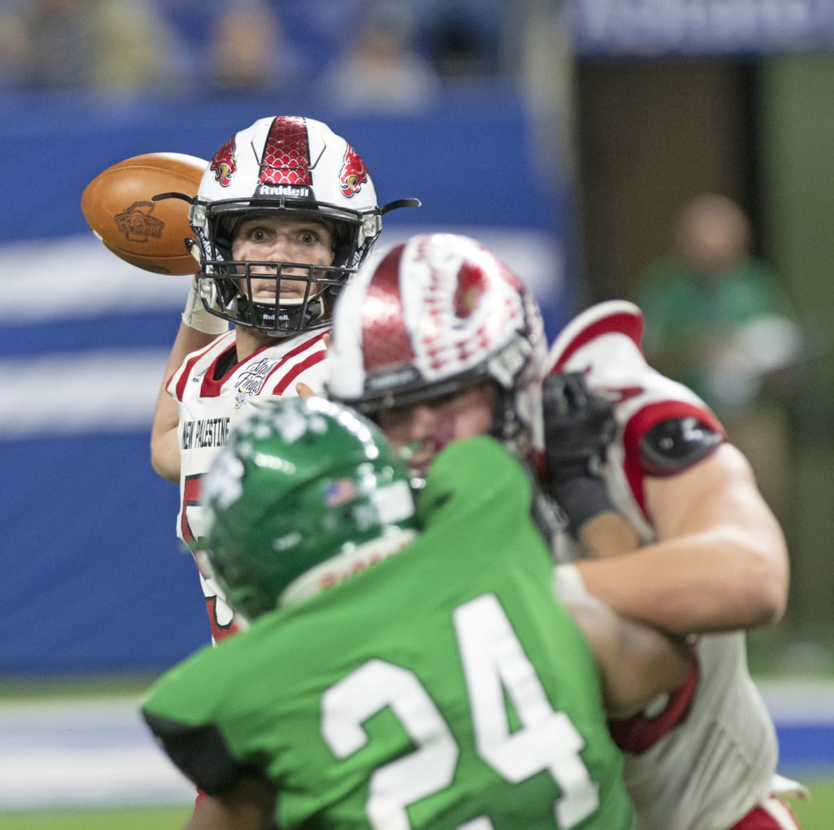 New Palestine's Eric Roudebush drops back to pass during the IHSAA 5A State Championship against Valparaiso on Friday, Nov. 29, 2019. (Tom Russo | Daily Reporter)