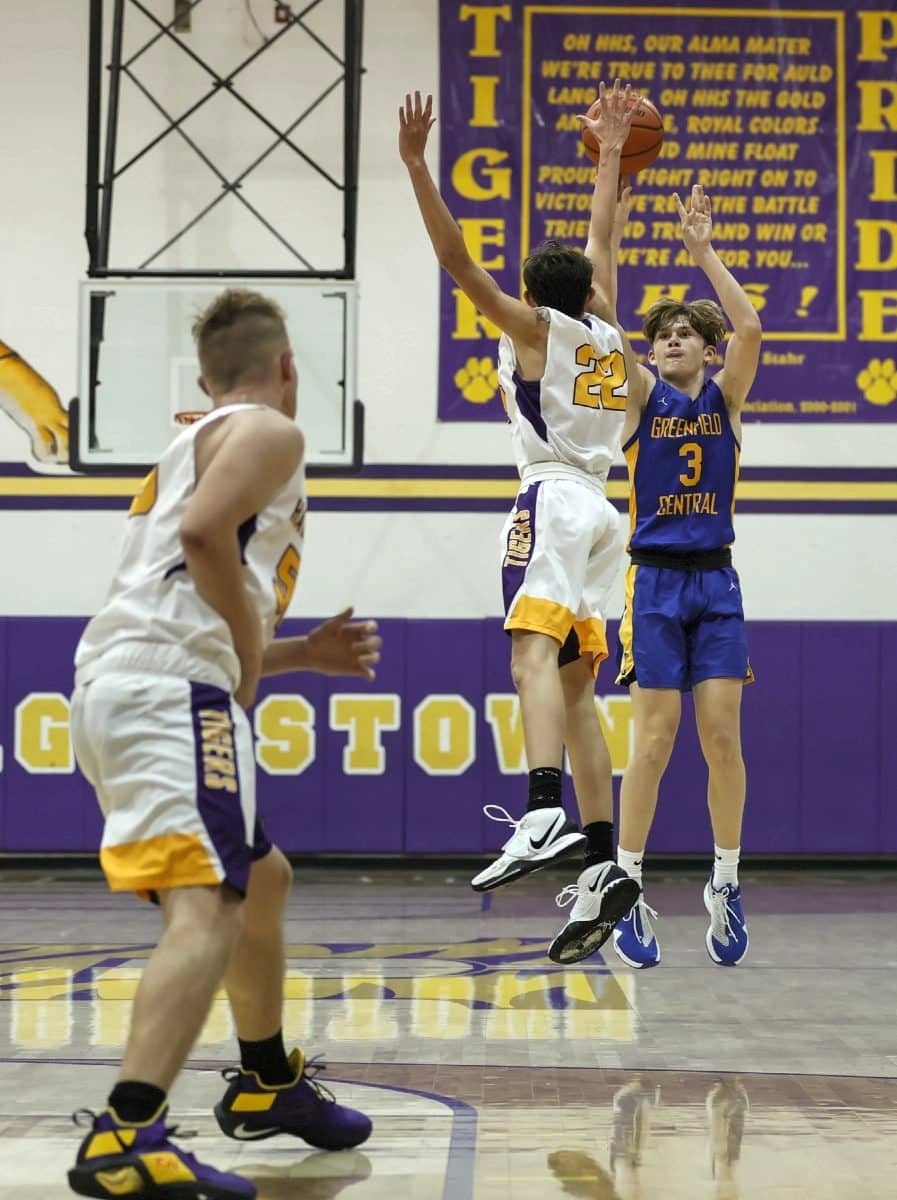 Greenfield-Central’s Dylan Moles (3) puts up a 3-pointer over Hagerstown’s Carter Jenkins (22) during their game at Hagerstown on Friday, Dec. 4, 2020. (Rob Baker/Daily Reporter) By: Rich Torres | Daily Reporter rtorres@greenfieldreporter.com