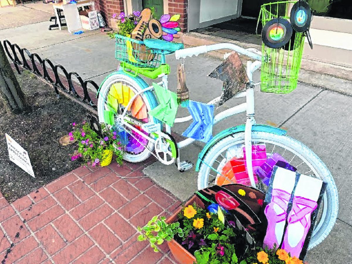 Hancock Arts won second place in the Bikes in Bloom Contest. Its entry sits outside the Twenty North art gallery at 21 N. State St. Photo provided