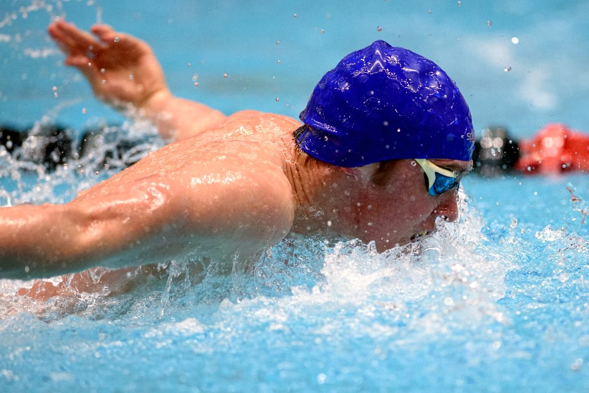 Greenfield Central's Samuel Logan swims the butterfly in the 200-yard medley relay during boys state swimming finals prelims at the IU Natatorium on the IUPUI campus in Indianapolis, Friday, Feb. 28, 2020.