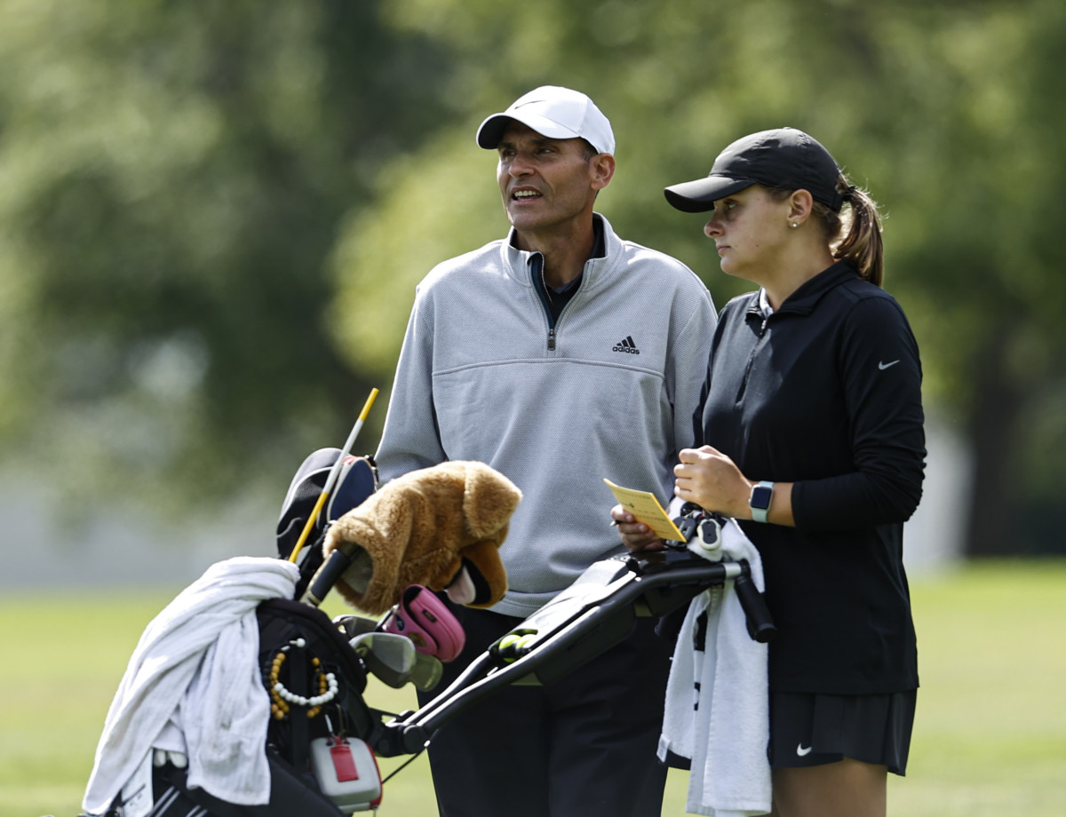 Mt. Vernon Meredith Johnson(r) and head coach Mike Miner talk while waiting to tee off on the 18th hole during the Lapel Girls Regional at The Edge Golf Course & Country Club in Anderson on Saturday September 25,2021.(Rob Baker/Daily Reporter)