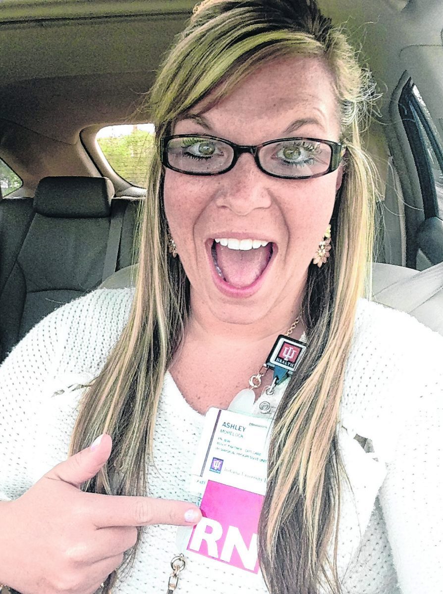 Ashley Morelock celebrates her certification as a registered nurse. Like the 9/11 first-responders whose courage touched her, “I can be one of those who puts on her mask and PPE and runs toward the chaos to help those in need.” Submitted photo