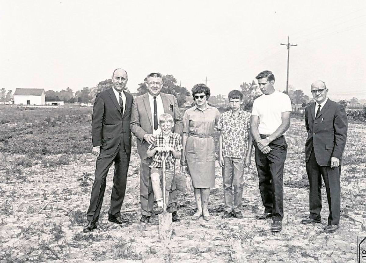 Ten-year-old Jeff Inskeep, third from the left, holding a shovel, poses with members of his family during a groundbreaking for his father's Ford dealership in Greenfield in 1968. (Submitted photo)